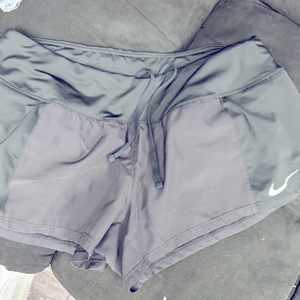 Black Nike running shorts